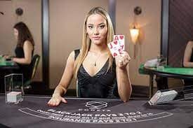 unitogel login live dealer studio with blackjack table and croupier broadcast on mobile screen